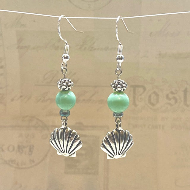 Silver seashell earrings with turquoise accent