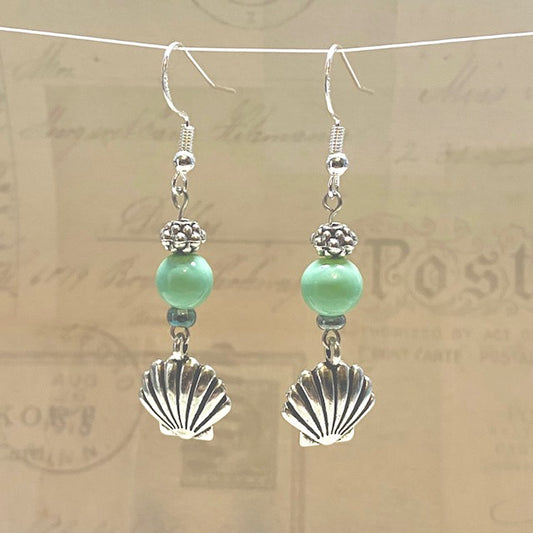 Silver seashell earrings with turquoise accent