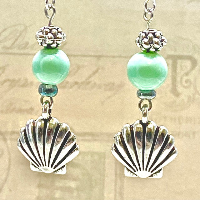 Silver seashell earrings with turquoise accent