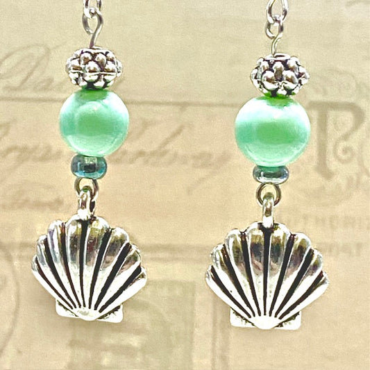 Silver seashell earrings with turquoise accent
